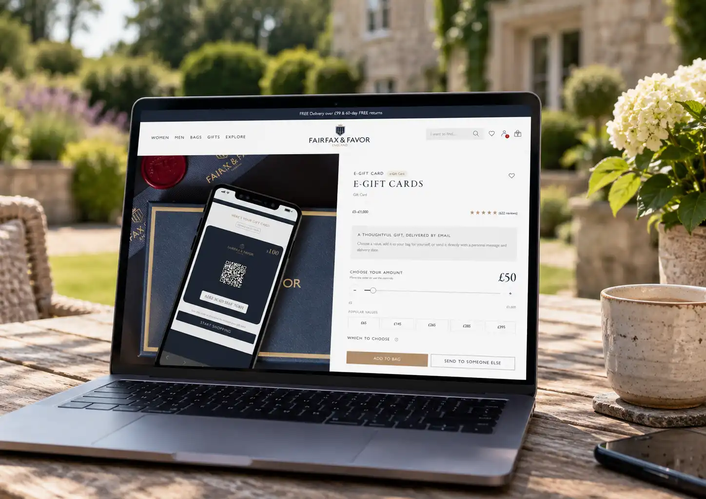 Fairfax & Favor e-gift card page on a laptop, with a digital gift card on a phone beside it
