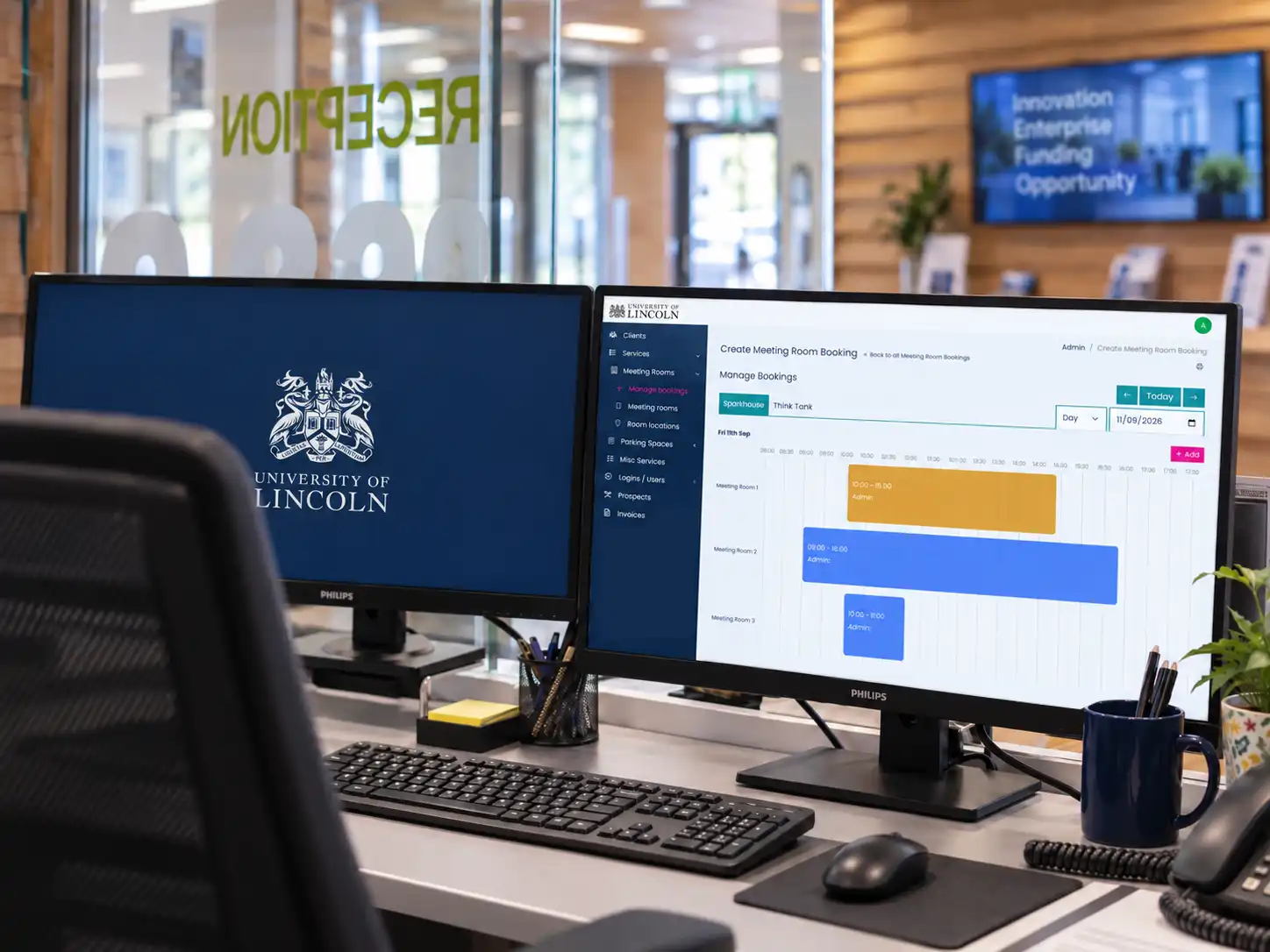 University of Lincoln Business Centre booking system on dual screens at Sparkhouse reception